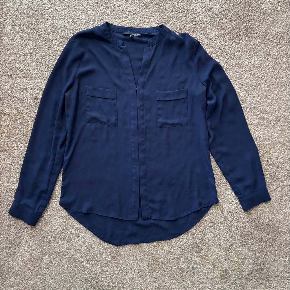 Navy blouse with front pocket detail. Size small.